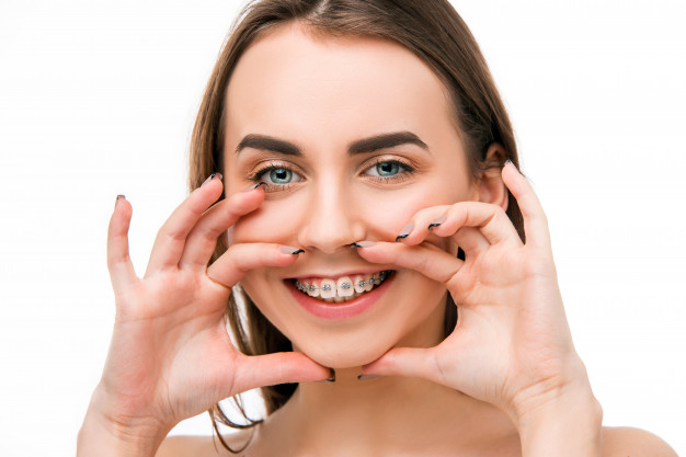 beautiful-young-woman-with-teeth-braces_155003-5633